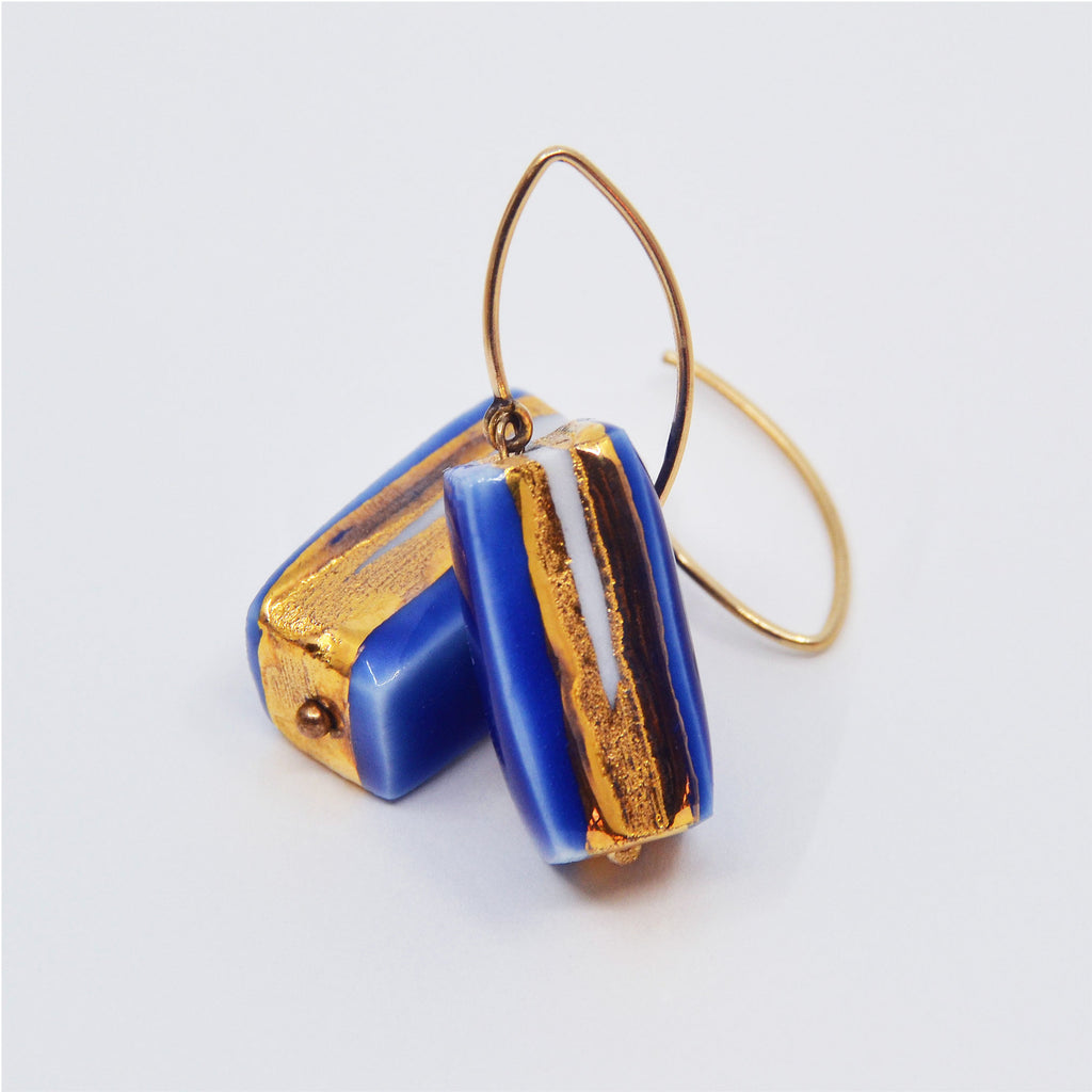Blue Zen Earrings. One-of-a-kind porcelain earrings with blue and 22 karat gold glaze, partially left unglazed.